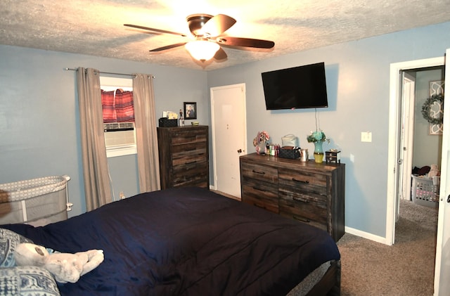 carpeted bedroom with a textured ceiling and ceiling fan