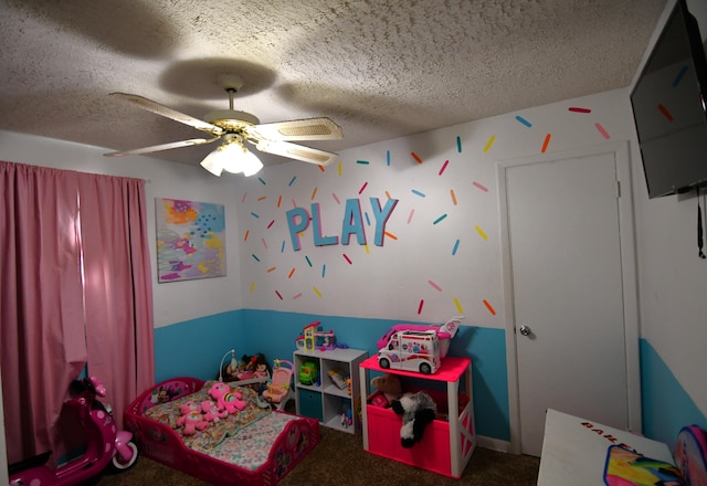 carpeted bedroom with a textured ceiling and ceiling fan