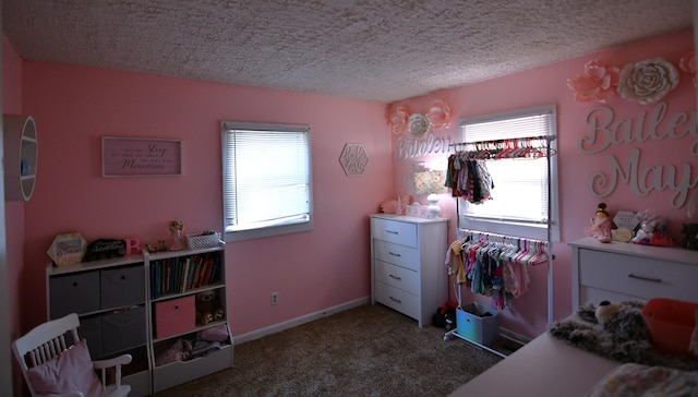 bedroom with carpet flooring and a textured ceiling