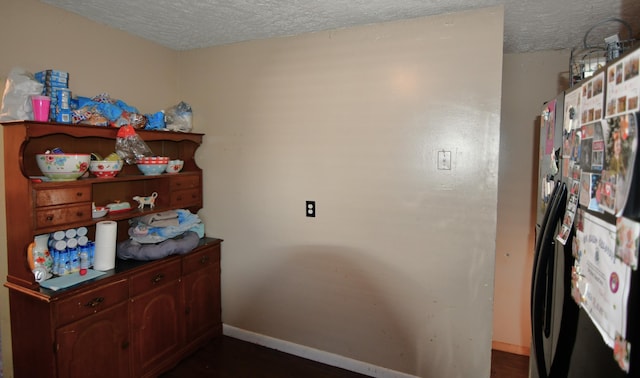 interior space featuring a textured ceiling