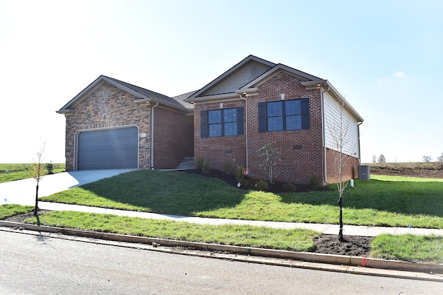 view of front of property featuring a front lawn and a garage