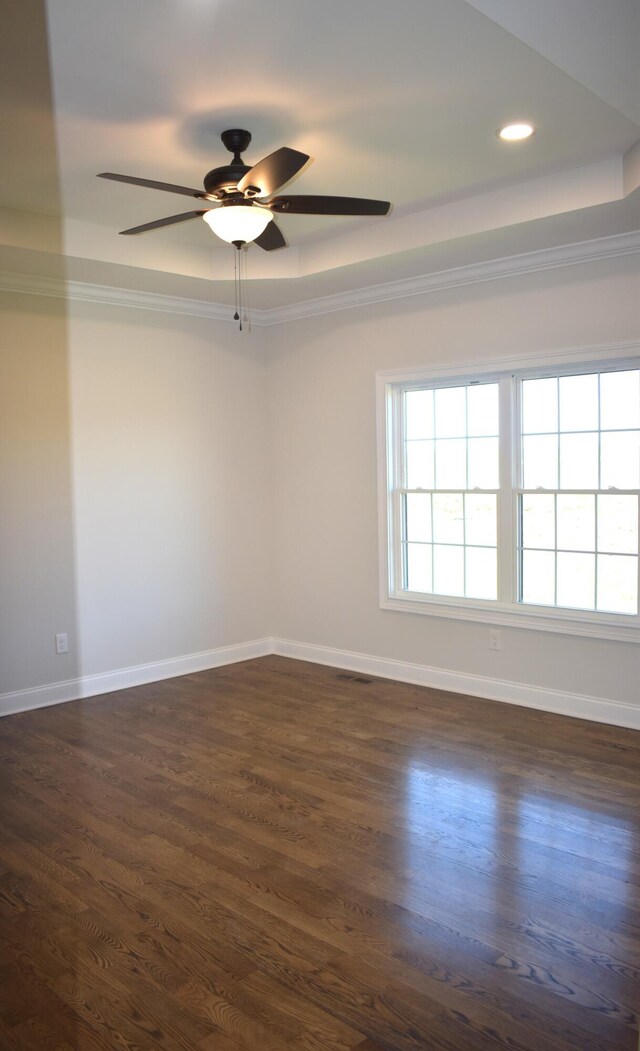 empty room with ceiling fan, dark wood-type flooring, and lofted ceiling