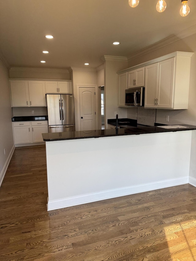 104 Linzi Way, Paris, KY 40361 - kitchen featuring stainless steel appliances, dark countertops, crown molding, white cabinets, and dark wood-type flooring