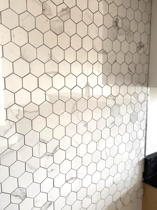 room details featuring tiled shower and elevator