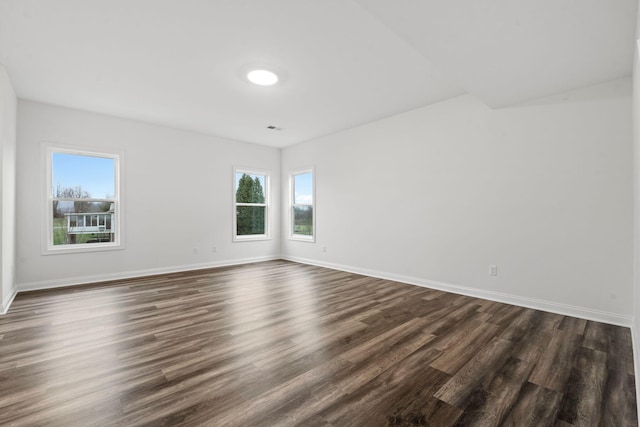 unfurnished room featuring dark hardwood / wood-style floors