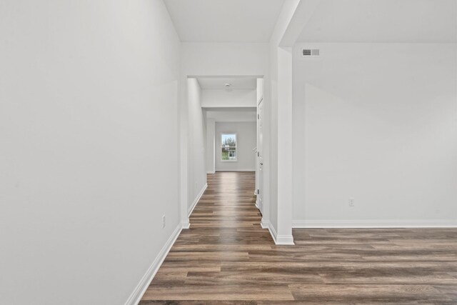 unfurnished living room featuring hardwood / wood-style floors