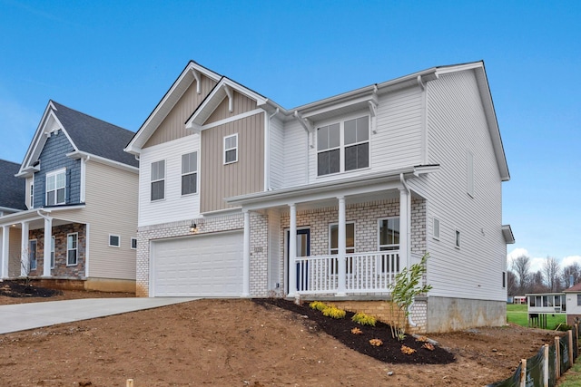 view of front of house with covered porch and a garage