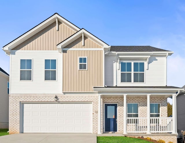 view of front facade with board and batten siding, covered porch, an attached garage, and concrete driveway