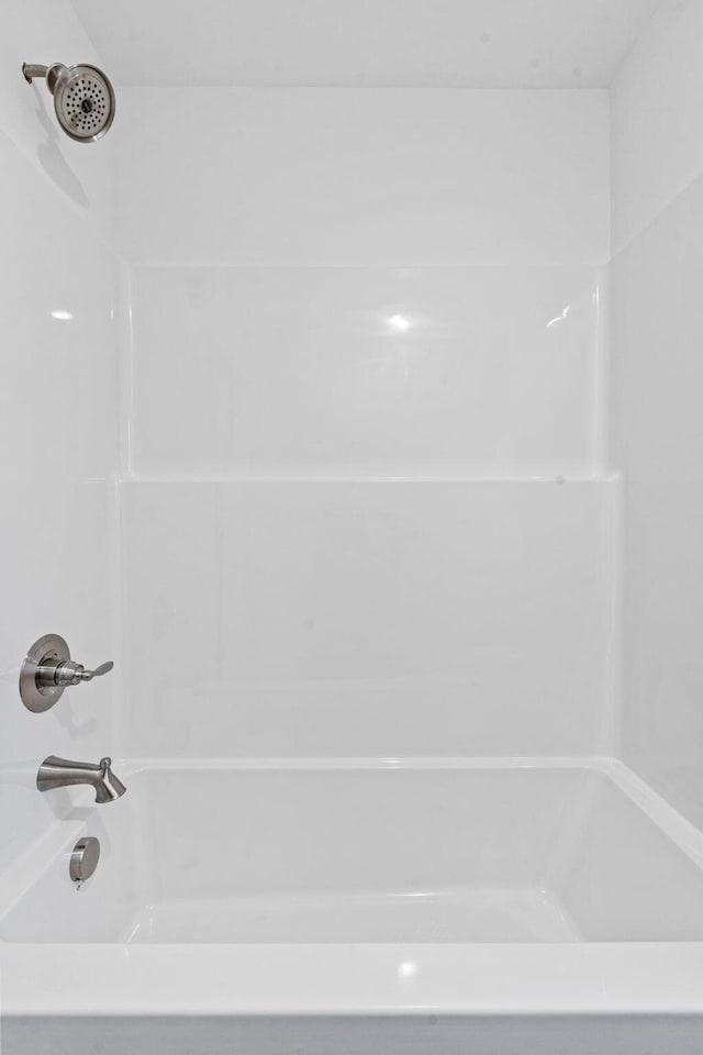 bathroom featuring washtub / shower combination