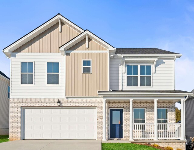 view of front of home with covered porch, cooling unit, and a garage