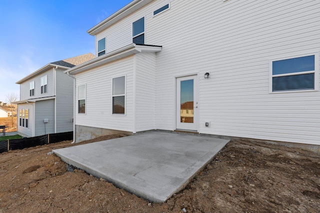 back of property featuring a patio area