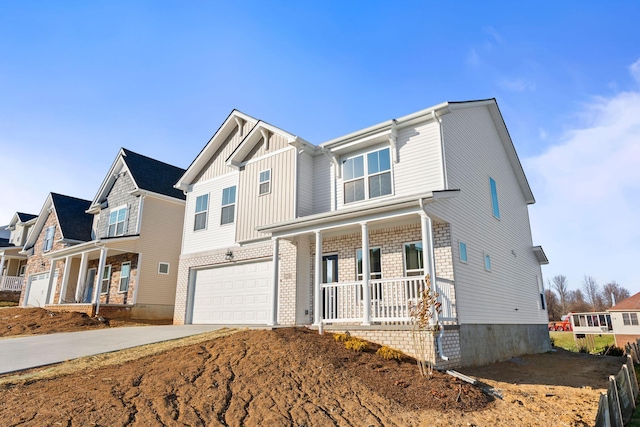 view of front facade with driveway, a garage, a residential view, covered porch, and board and batten siding