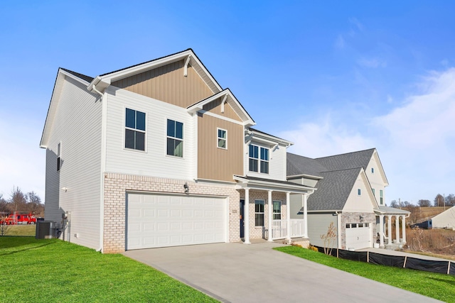 traditional home with an attached garage, brick siding, driveway, and a front lawn