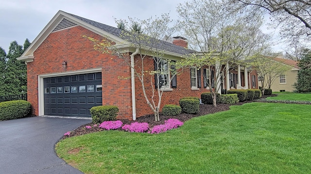 view of home's exterior with a yard and a garage