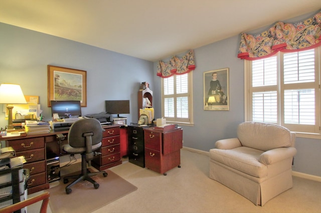 carpeted home office with plenty of natural light