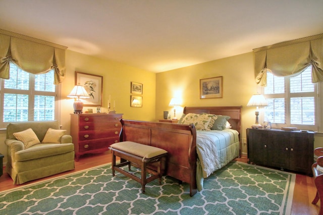 bedroom with hardwood / wood-style floors