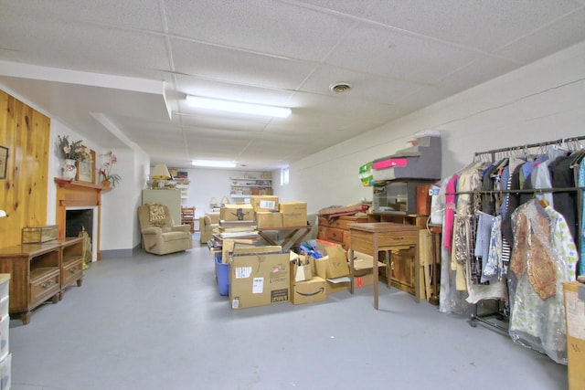 basement featuring a paneled ceiling