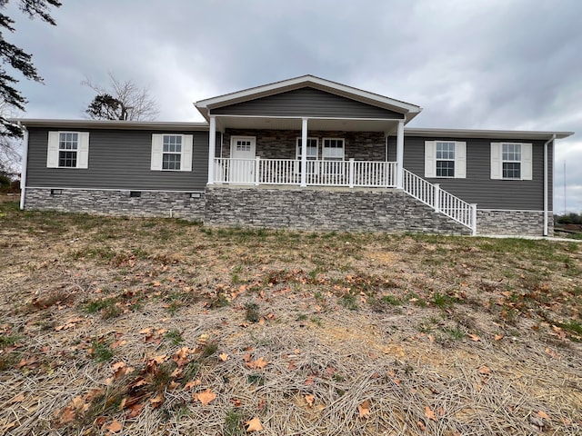 view of front of property with covered porch and a front yard