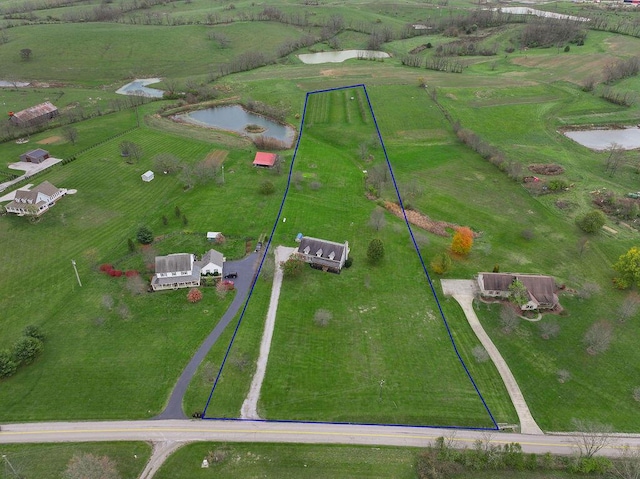 bird's eye view with a water view and a rural view