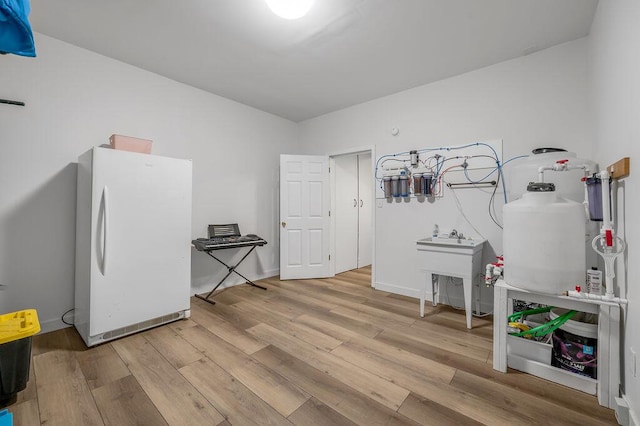 misc room with light hardwood / wood-style floors