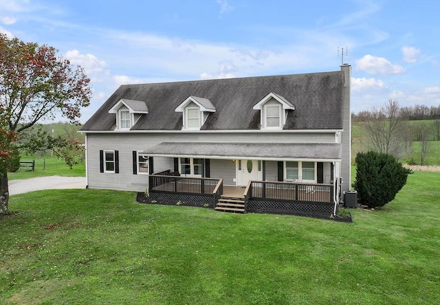 cape cod house featuring a front yard, a porch, and central AC