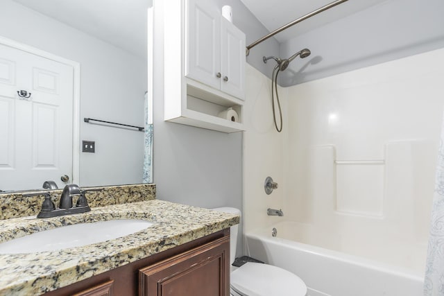 full bathroom featuring bathtub / shower combination, vanity, and toilet