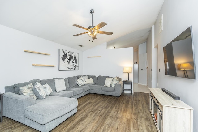 living room featuring lofted ceiling, dark hardwood / wood-style floors, and ceiling fan