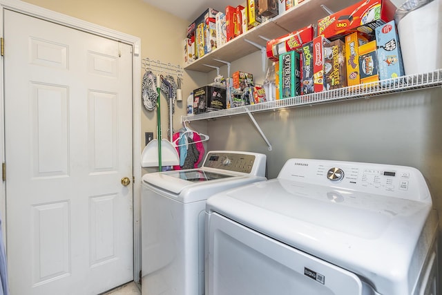 laundry area featuring washing machine and clothes dryer