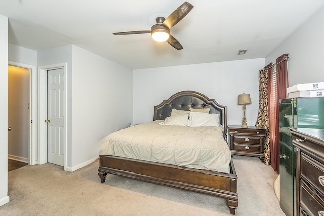 bedroom featuring light colored carpet and ceiling fan