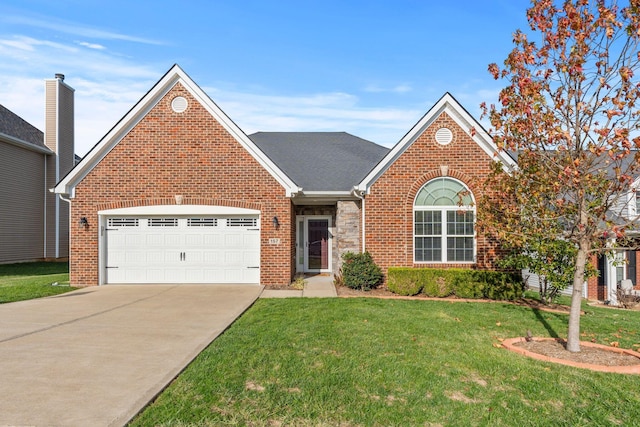 view of property featuring a garage and a front lawn