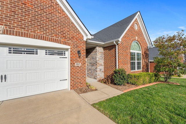 view of front of home featuring a garage and a front lawn