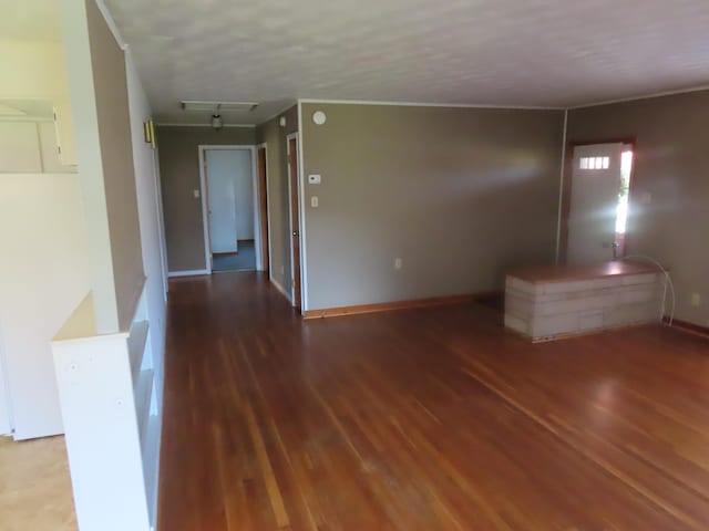 unfurnished room with wood-type flooring