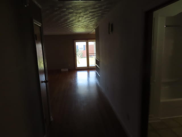 hallway featuring dark wood-type flooring