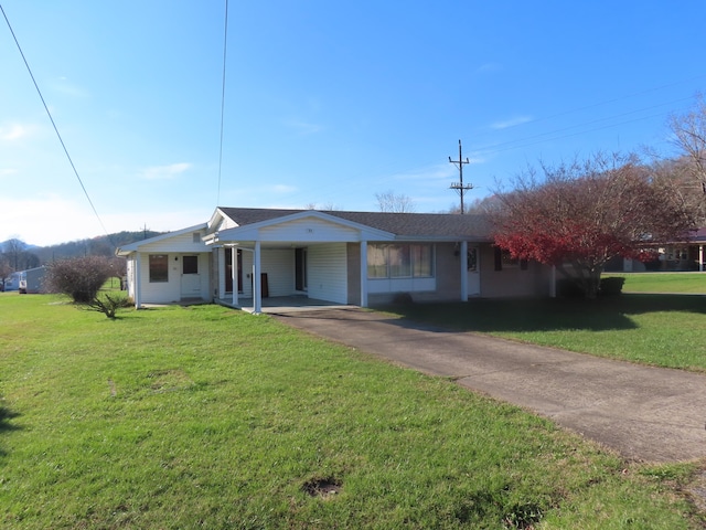 single story home featuring a front yard and a carport