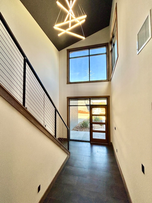 foyer entrance with high vaulted ceiling