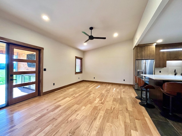 interior space with ceiling fan and light wood-type flooring