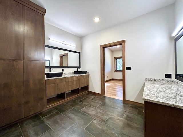 bathroom featuring hardwood / wood-style floors and vanity