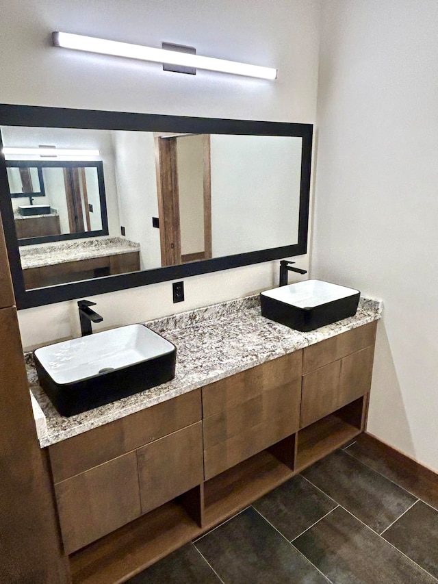 bathroom with vanity and tile patterned flooring