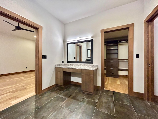 bathroom featuring hardwood / wood-style floors, ceiling fan, and vanity