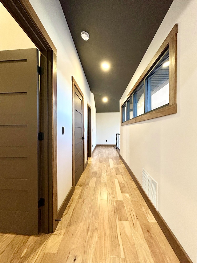 corridor featuring light hardwood / wood-style flooring