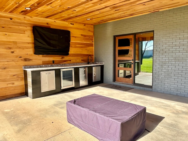 view of patio / terrace featuring area for grilling and sink