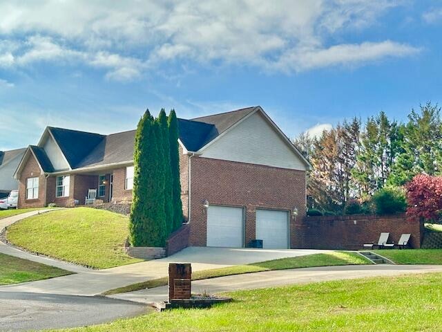 151 Surrounding Hills Dr, Somerset, KY 42503 - view of side of property with a garage and a lawn