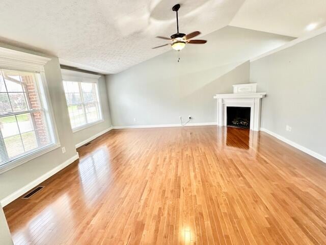 151 Surrounding Hills Dr, Somerset, KY 42503 - unfurnished living room featuring hardwood / wood-style floors, ceiling fan, a textured ceiling, and vaulted ceiling