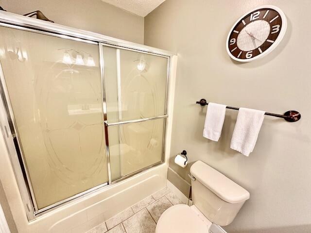 151 Surrounding Hills Dr, Somerset, KY 42503 - bathroom with tile patterned flooring, toilet, and bath / shower combo with glass door