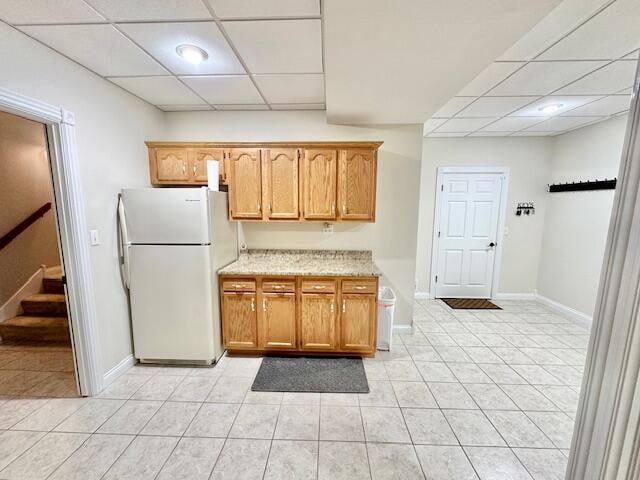 151 Surrounding Hills Dr, Somerset, KY 42503 - kitchen with a paneled ceiling, white refrigerator, and light tile patterned flooring