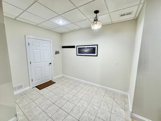 151 Surrounding Hills Dr, Somerset, KY 42503 - spare room with a paneled ceiling and light tile patterned floors