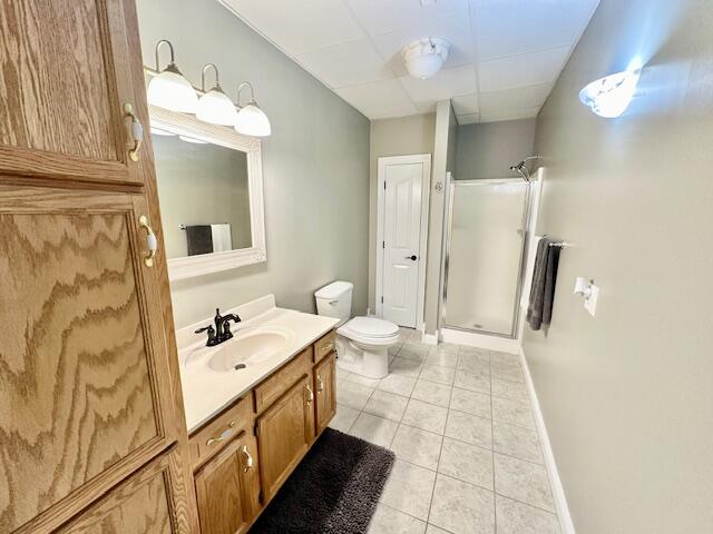 151 Surrounding Hills Dr, Somerset, KY 42503 - bathroom with toilet, vanity, tile patterned floors, and an enclosed shower