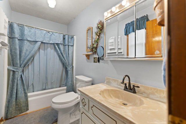 full bathroom featuring vanity, shower / bathtub combination with curtain, a textured ceiling, and toilet