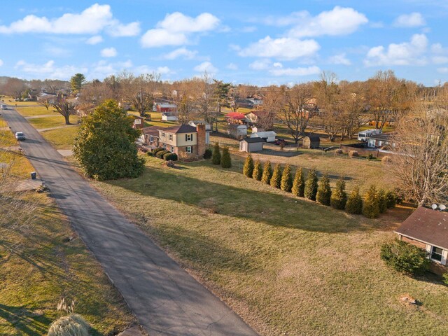 split level home with a garage and a front yard