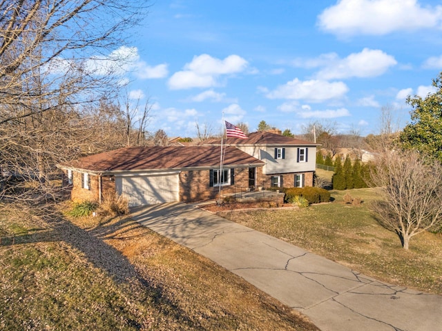 view of front of house with a garage and a front yard